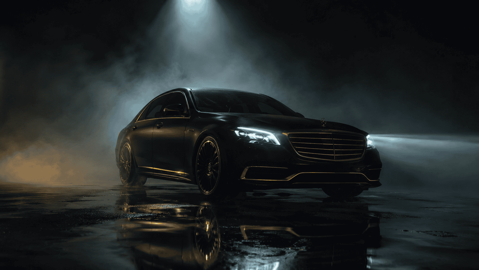 Black luxury sedan parked in foggy night with reflective wet surface.