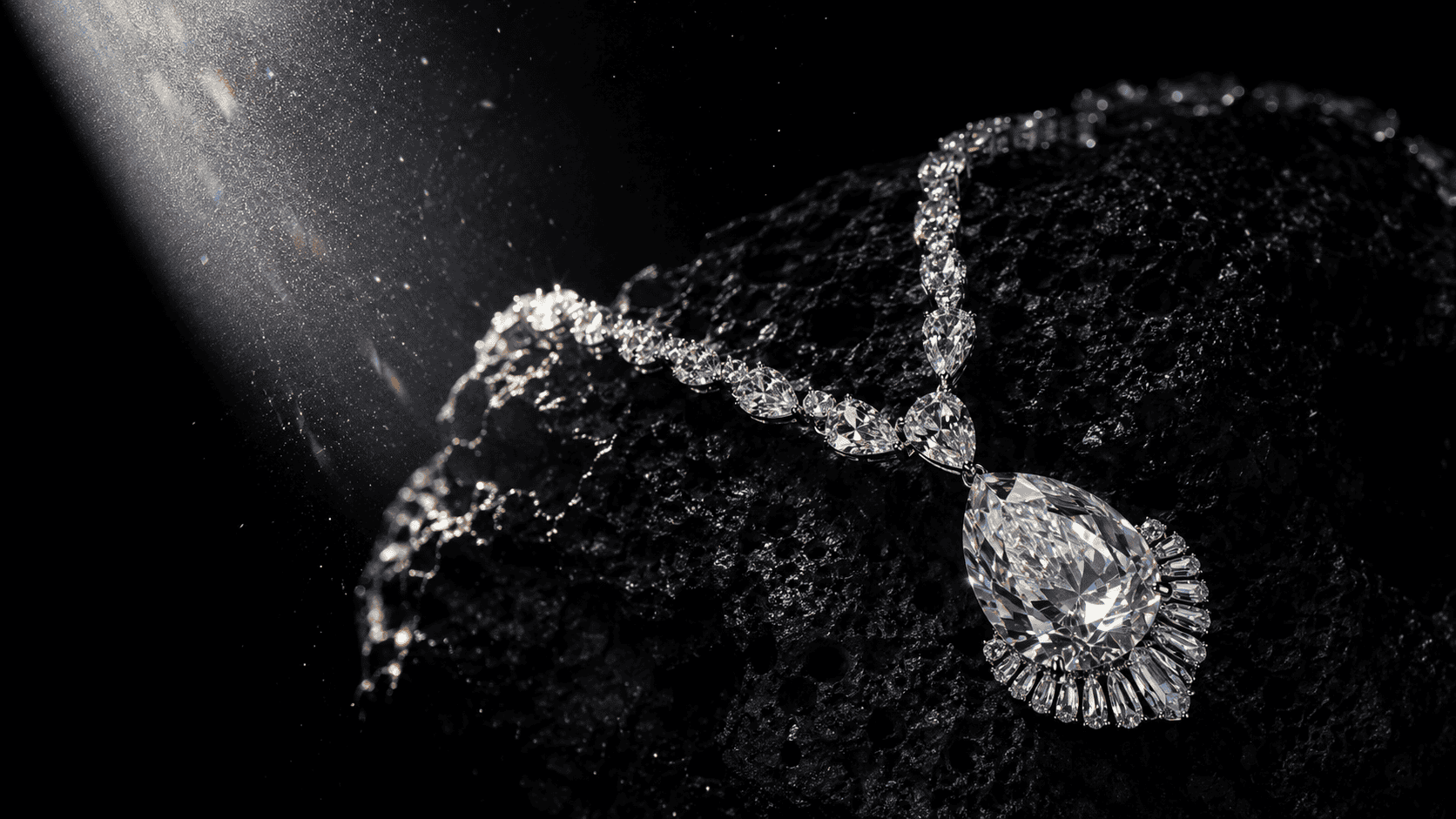 Diamond necklace draped over black stone with prismatic light refractions.