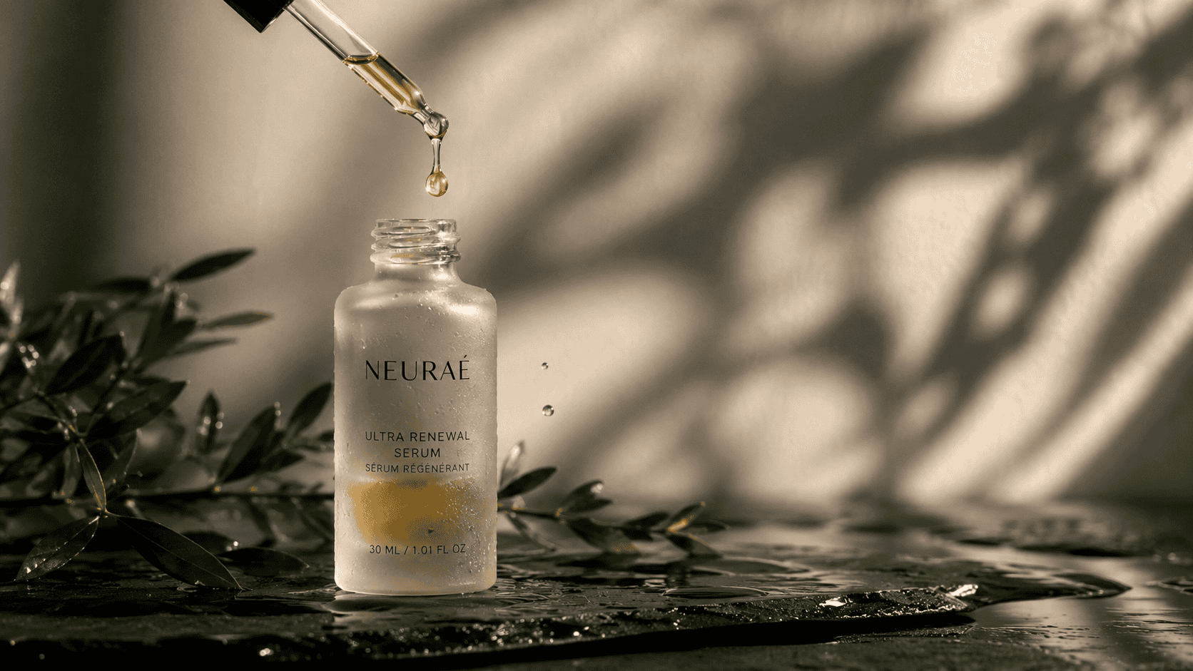 Luxury renewal serum in a glass bottle with dropper, natural botanical background.
