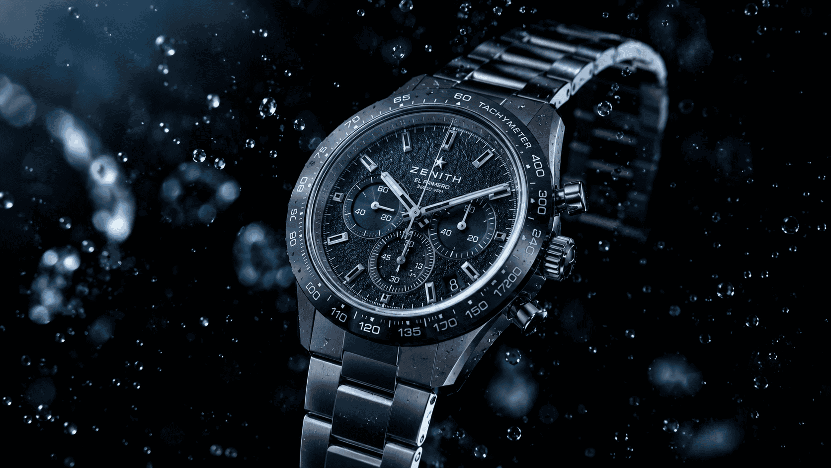 Stylish black chronograph watch with tachymeter and stainless steel band.
